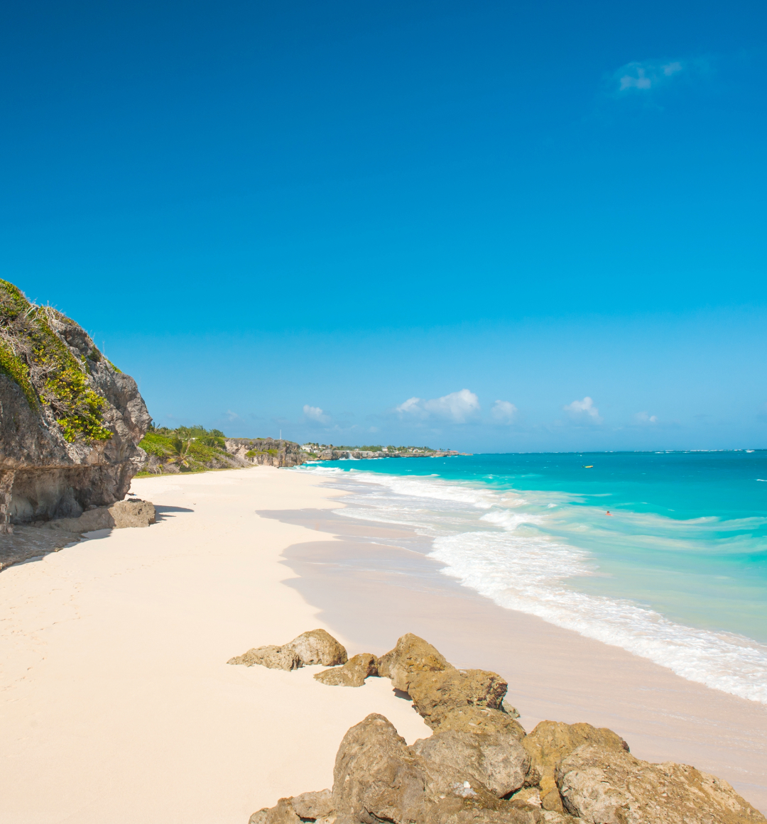 Light sandy Barbados beach with bright blue water