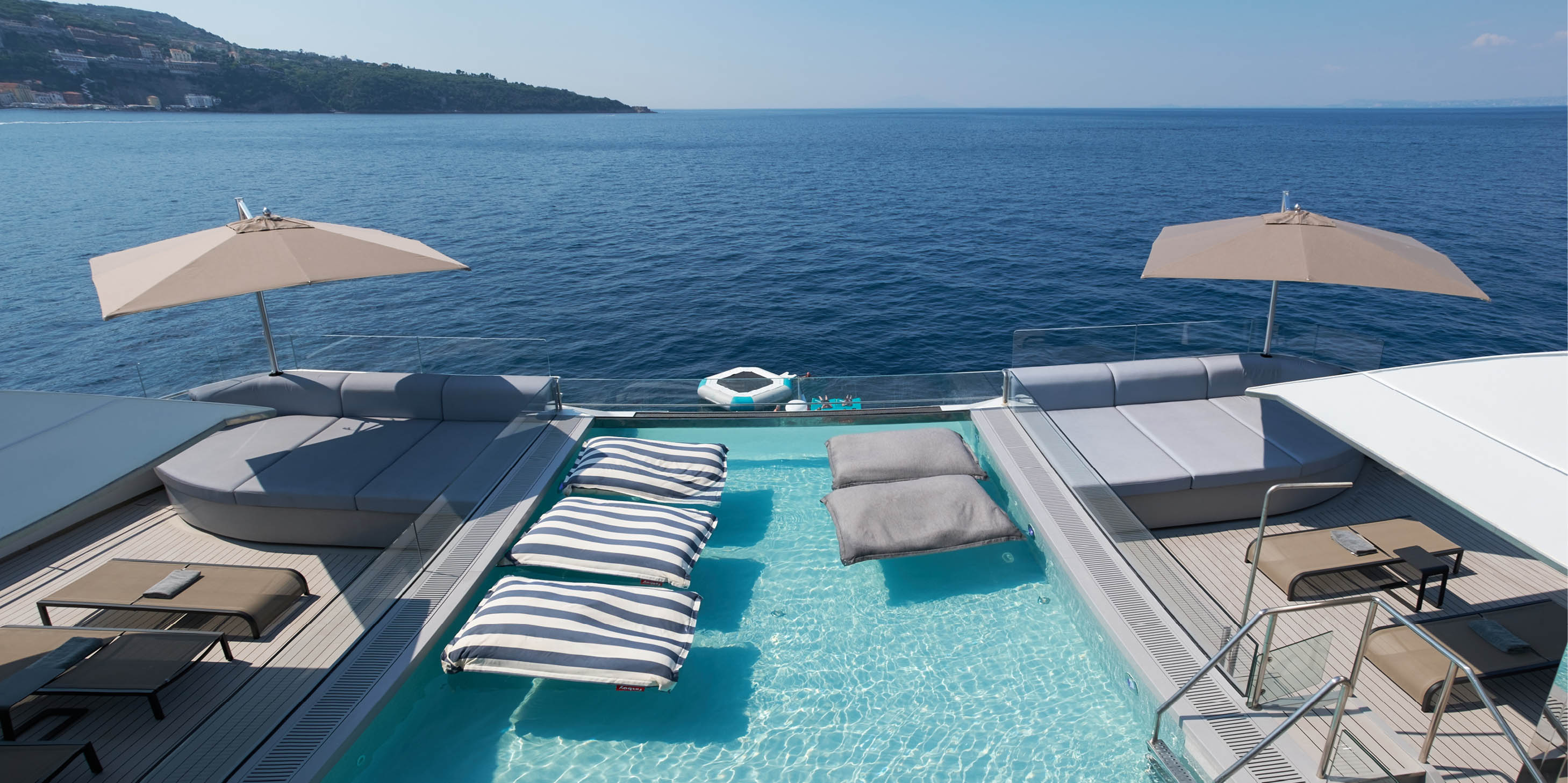 Man swimming in a pool on board a luxury yacht