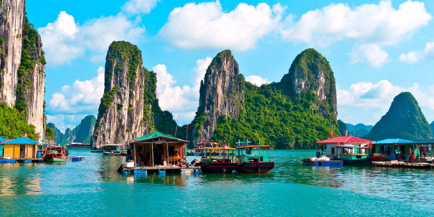 Floating village near rock islands in Halong Bay
