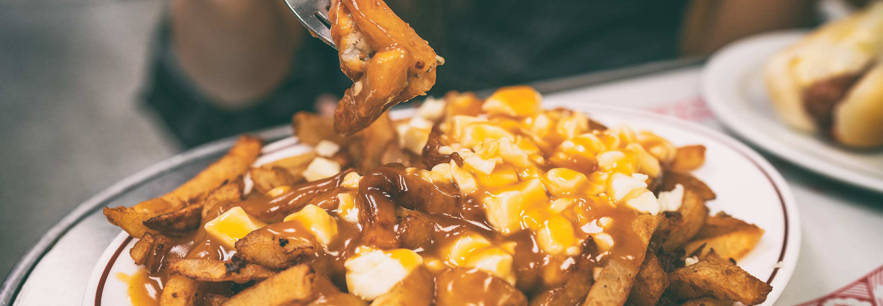 Relish a bowl of Canada’s beloved comfort food, Poutine