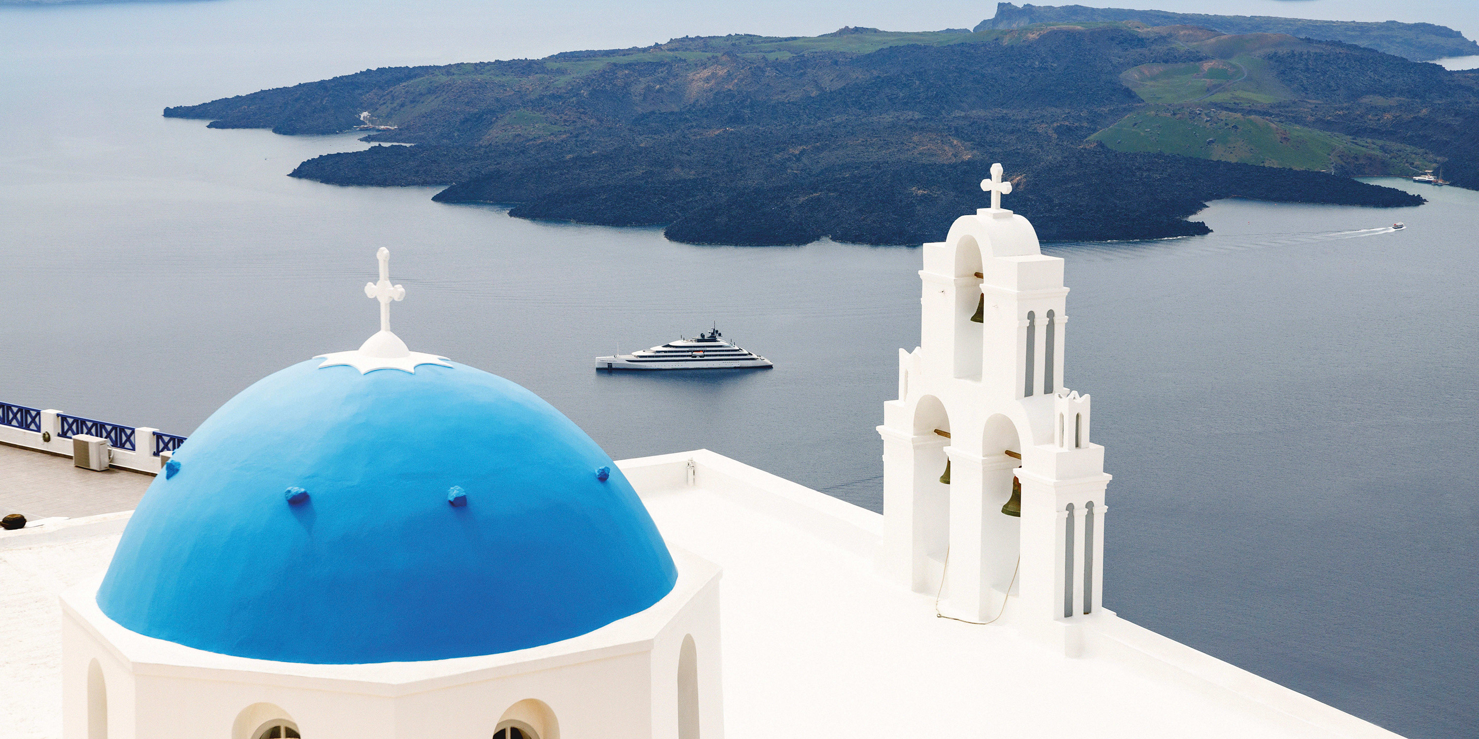 Emerald Azzurra cruising through Santorini, Greece