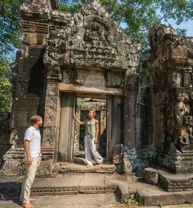 Couple exploring Angkor Wat, Cambodia