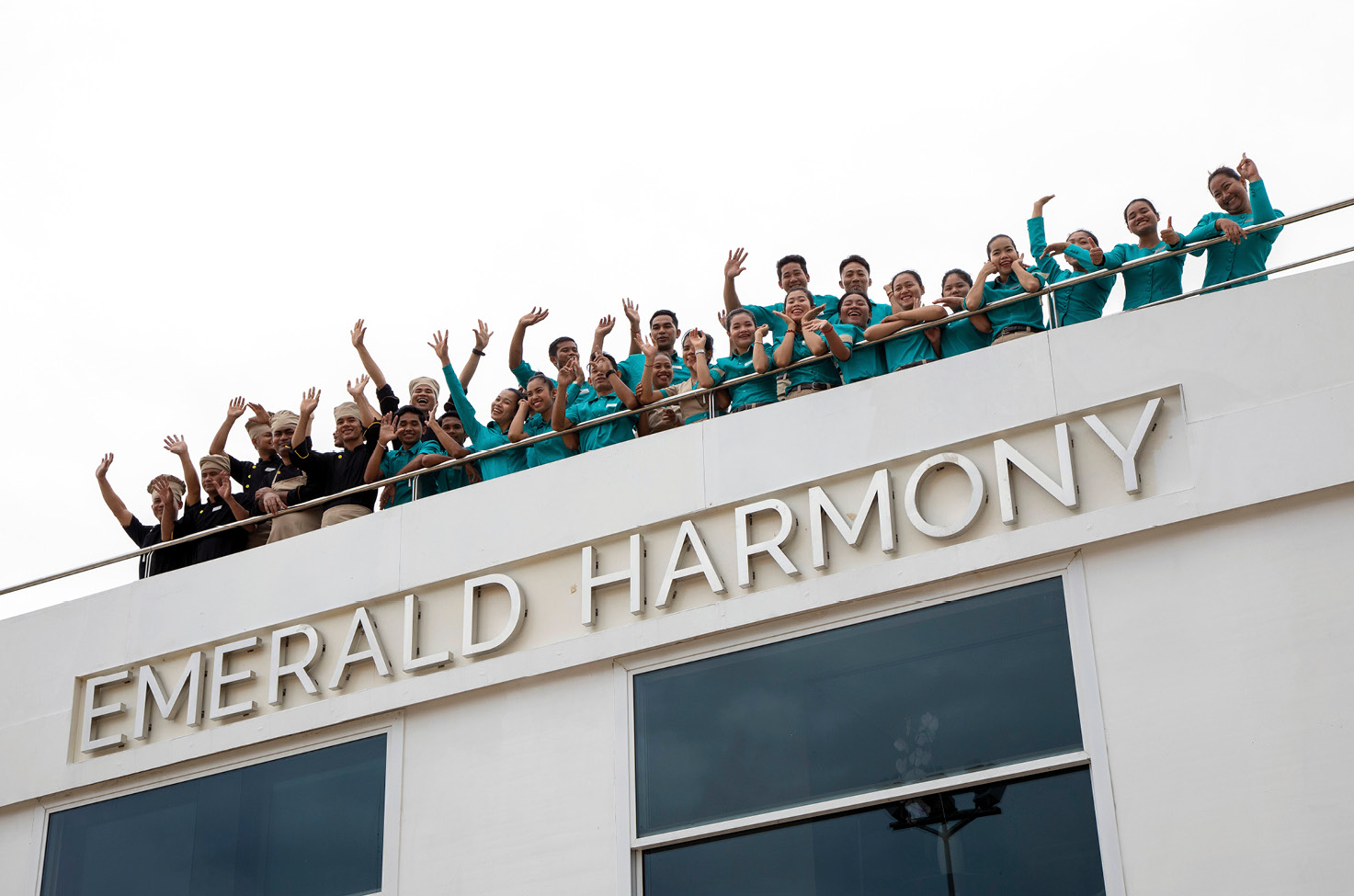 The crew on board Emerald Harmony, a luxury river cruise ship