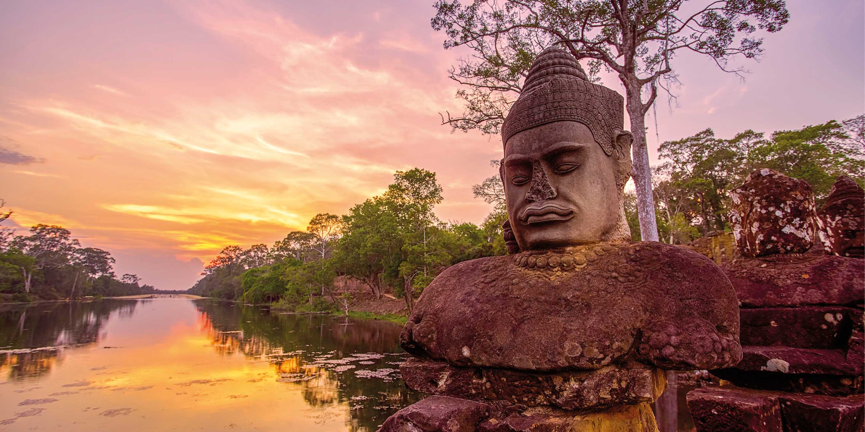 Ancient monument at sunset near the riverbed outside of Angkor Thom in Siem Reap, Cambodia