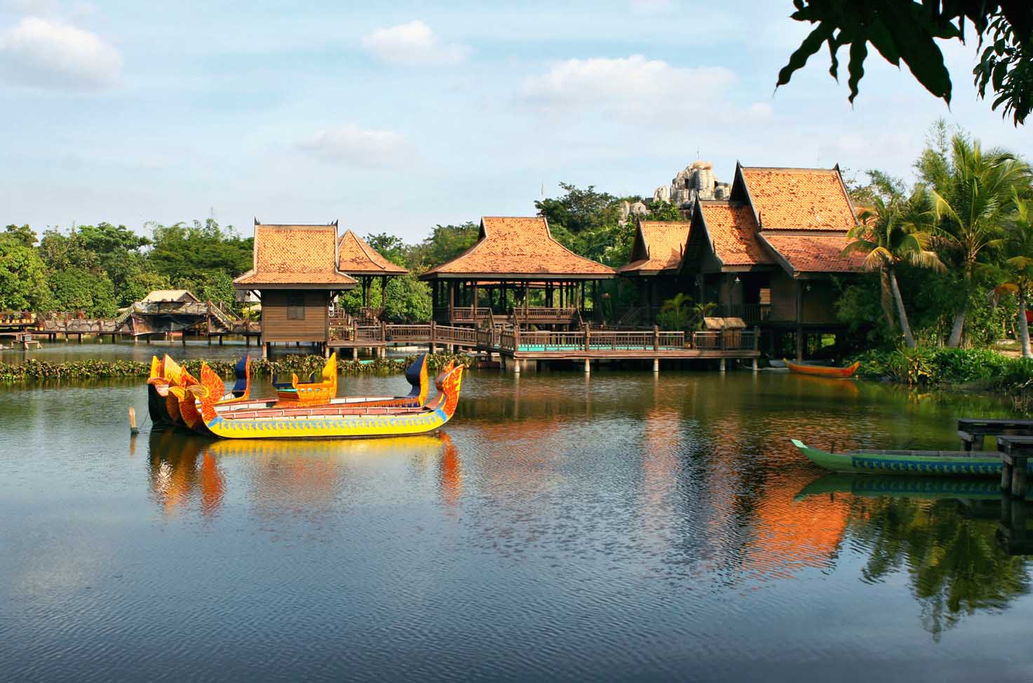 Tonle Sap in Siem Reap, Cambodia, with traditional huts and boats built on the river near the trees