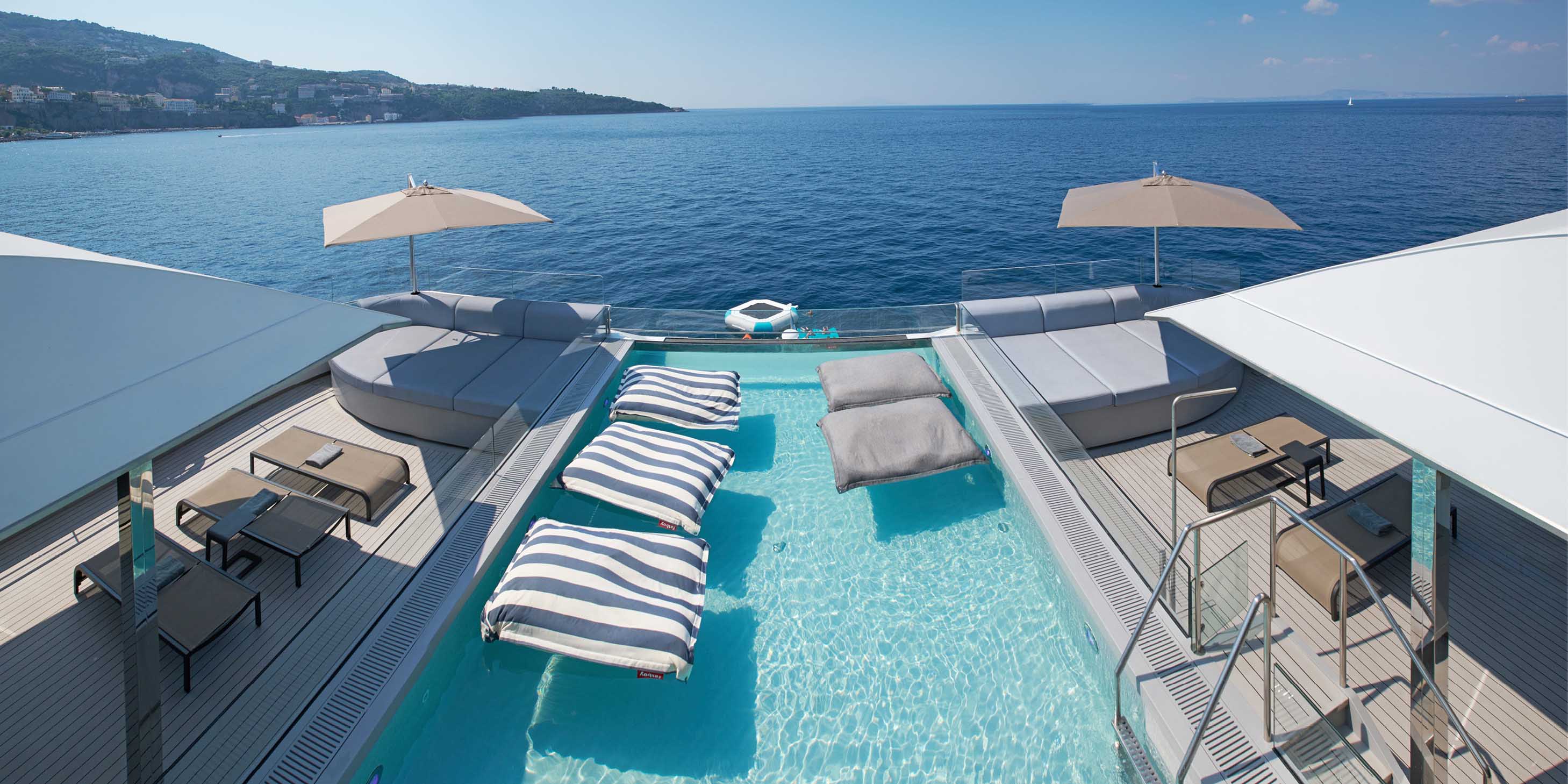 Outdoor infinity pool at the aft of a luxury yacht